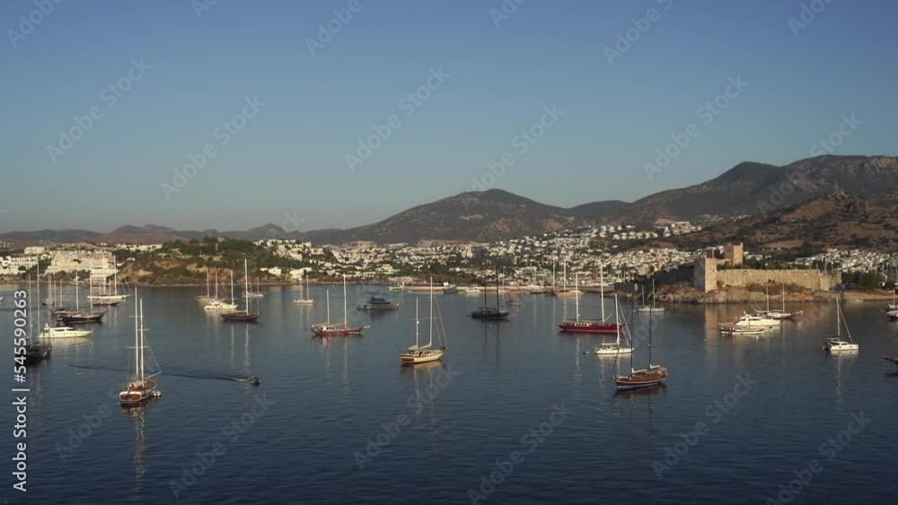 Aerial view of Bodrum bay, Turkey. Seashore, sailboats, boats, mountains and fort in Bodrum. Aerial view of Bodrum bay, Turkey. Seashore, sailboats, boats, mountains and fort in Bodrum.
