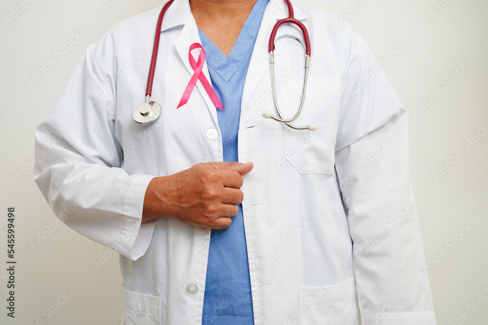 Asian woman doctor with pink ribbon, World Breast Cancer Day at October. Asian woman doctor with pink ribbon, World Breast Cancer Day at October.