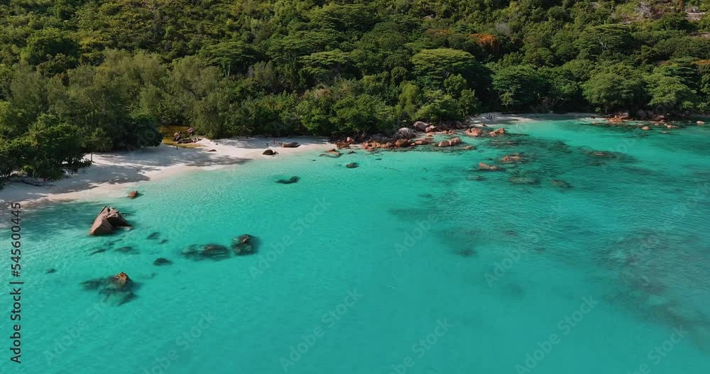 Aerial panning view of the magnificent Anse Lazio beach with it's azure coloured waters Praslin,Seychelles Aerial panning view of the magnificent Anse Lazio beach with it's azure coloured waters Praslin,Seychelles