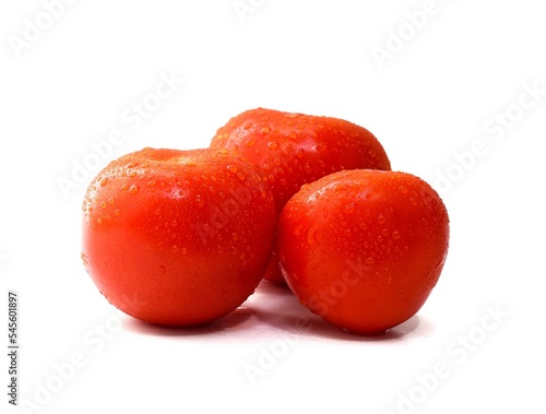 Red ripe tomato with water drops isolated on white background, Solanum lycopersicum