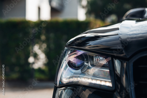 The headlight of modern and luxury car at the city street