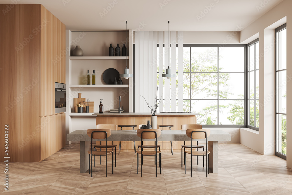 Fototapeta premium Light kitchen interior with bar countertop, eating table and panoramic window