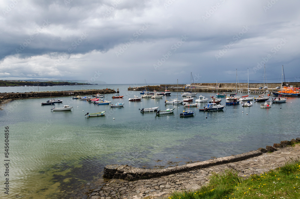 Fototapeta premium View of Portrush harbour with small boats 