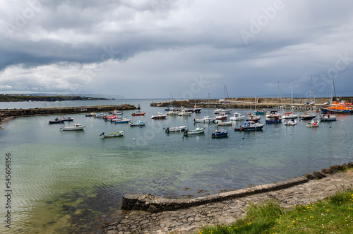 View of Portrush harbour with small boats 