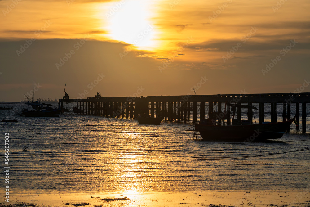 Silhouette fisherman boats and bridge at sunset, Chonburi