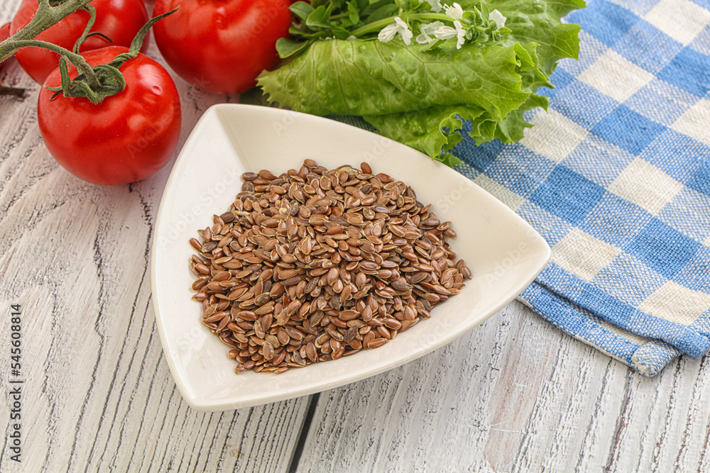 Dry Raw flax seed in the bowl Dry Raw flax seed in the bowl