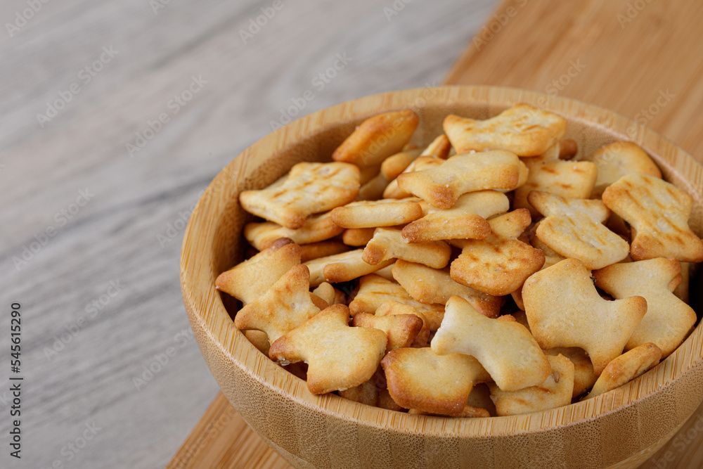 Wooden bowl of delicious goldfish crackers Wooden bowl of delicious goldfish crackers