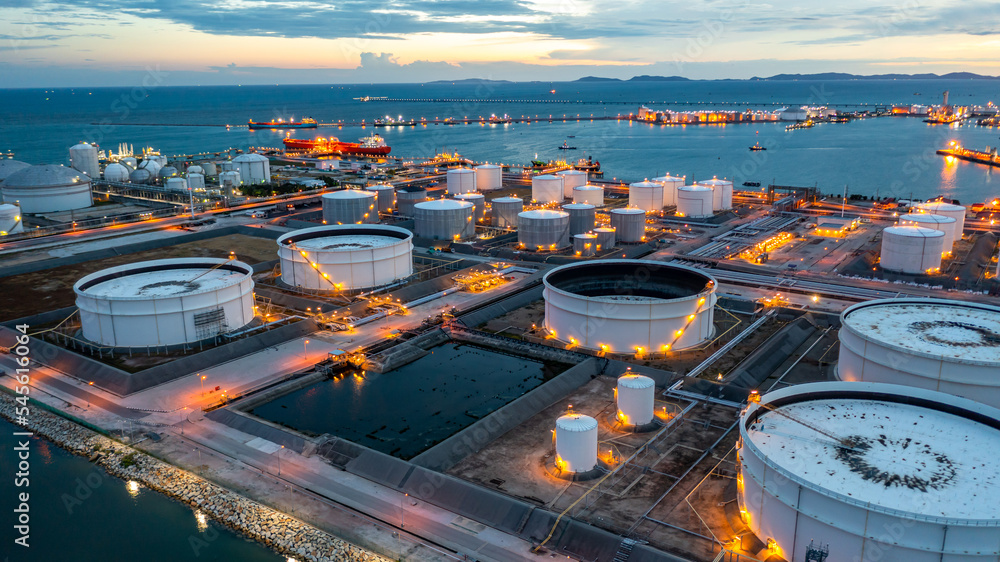 Aerial view oil terminal industrial facility storage tank oil and petrochemical product for transport storage facility, Storage tank petroleum petrochemical refinery product at oil terminal at nihgt. - obrazy, fototapety, plakaty 