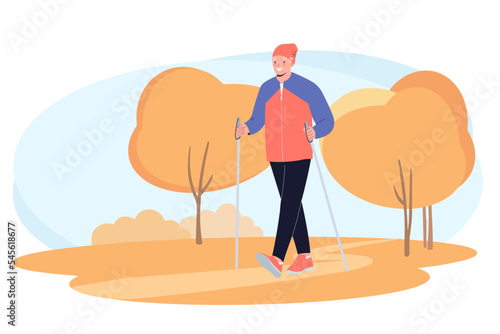 Senior elderly man training Nordic walking with ski trekking poles in autumn forest. Active rest outdoors. Concept of active healthy lifestyle of seniors.