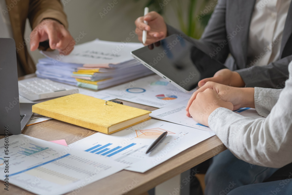 Marketing, Finance, Accounting, Planning, Team of business use calculators and graph analysis computer laptop tablets to plan marketing strategies and make profitable investments for the company. Marketing, Finance, Accounting, Planning, Team of business use calculators and graph analysis computer laptop tablets to plan marketing strategies and make profitable investments for the company.