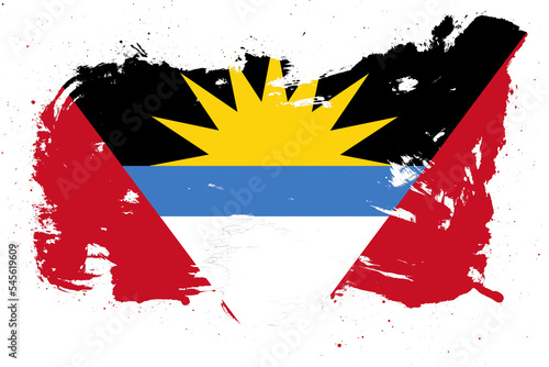 Antigua and barbuda flag with painted grunge brush stroke effect on white background photo