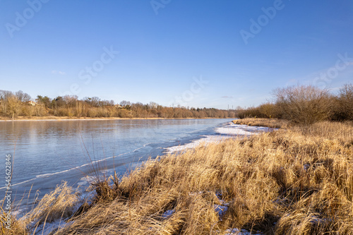 The bank of the Narew River in winter  near the dam in D  be