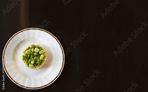 Soy Beans And Polenta On A Plate, Round Shape, Dark Brown Background, Off Centre, Negative Space
