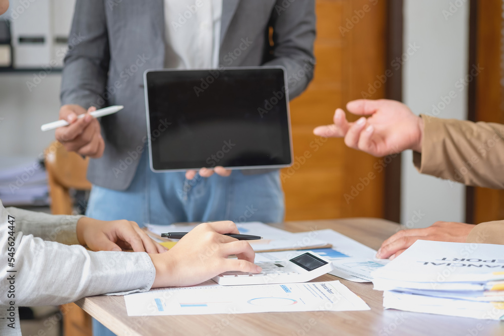 Marketing, Finance, Accounting, Planning, A team of businessmen plan with their laptops and graph charts for their profits and use a calculator to calculate their company is annual balance. Marketing, Finance, Accounting, Planning, A team of businessmen plan with their laptops and graph charts for their profits and use a calculator to calculate their company is annual balance.
