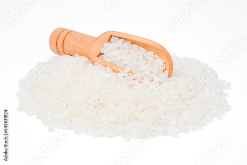 raw rice japanese in wooden scoop on white background.