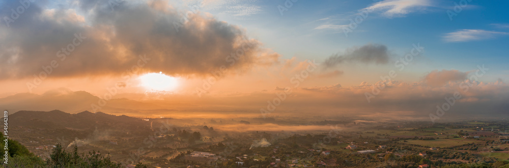 Panoramic view of Olbia at sunrise in the fog, Sardinia