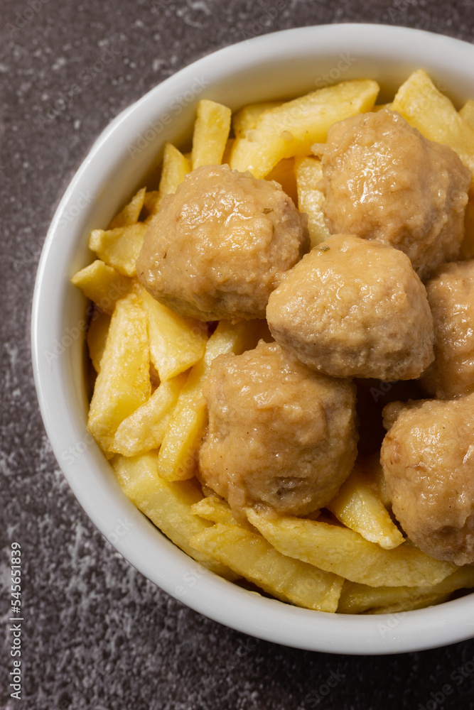 Delicious homemade meatballs with potatoes and traditional sauce. Delicious homemade meatballs with potatoes and traditional sauce.