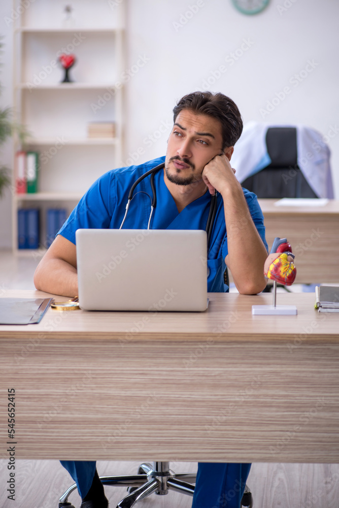 Young male doctor working in the clinic Young male doctor working in the clinic
