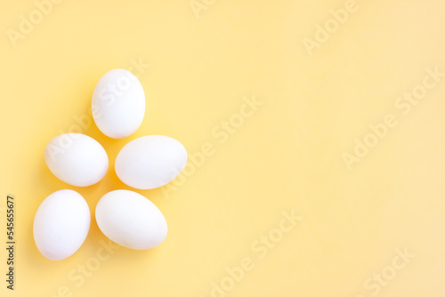 White eggs on yellow background, Duck eggs.