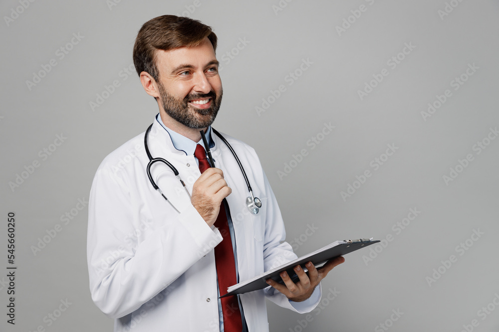 Free Photo | Smiling doctor young girl wearing stethoscope in medical gown  and dental brace points to paper question mark on her hand on isolated  yellow background