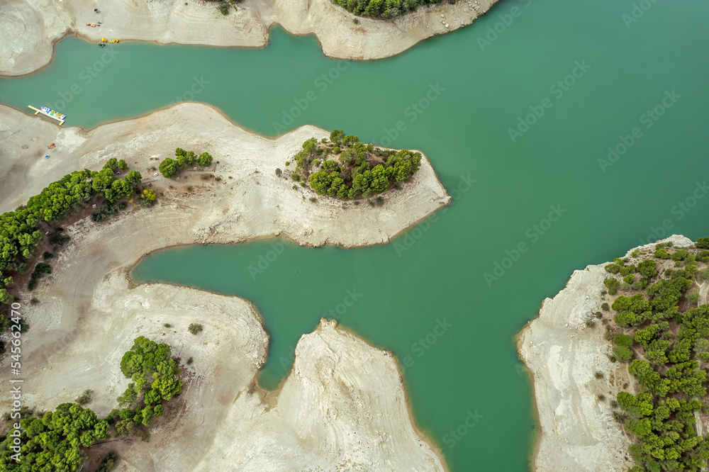 Naklejka premium The drone aerial view of Guadalhorce reservoir in the mountains of Andalusia in southern Spain in summer. 