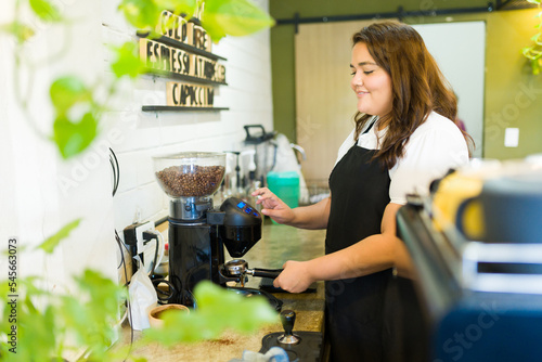 Female barista working at the coffee shop