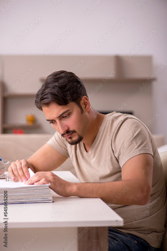 Young male employee working from house Young male employee working from house