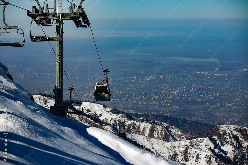 Obraz premium Almaty mountains. Shymbulak Ski Resort Hotel now-capped Tian Shan in Almaty city, Kazakhstan, Central Asia.