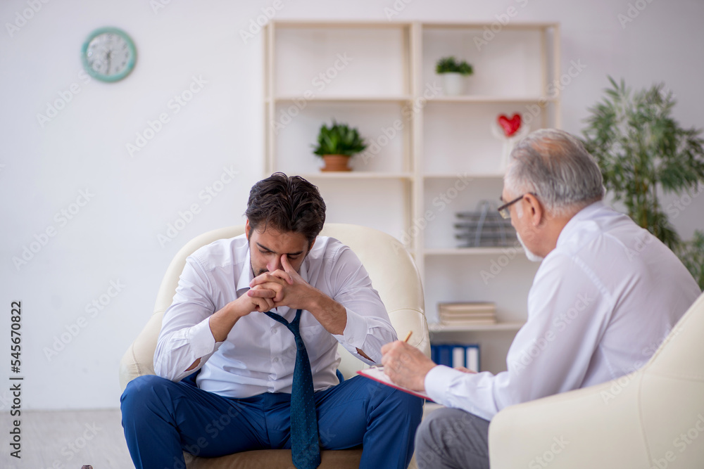 Young businessman employee visiting psychologist Young businessman employee visiting psychologist