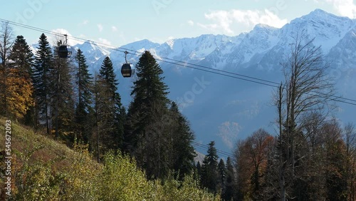 cable car in autumn. cabins move against the background of mountains