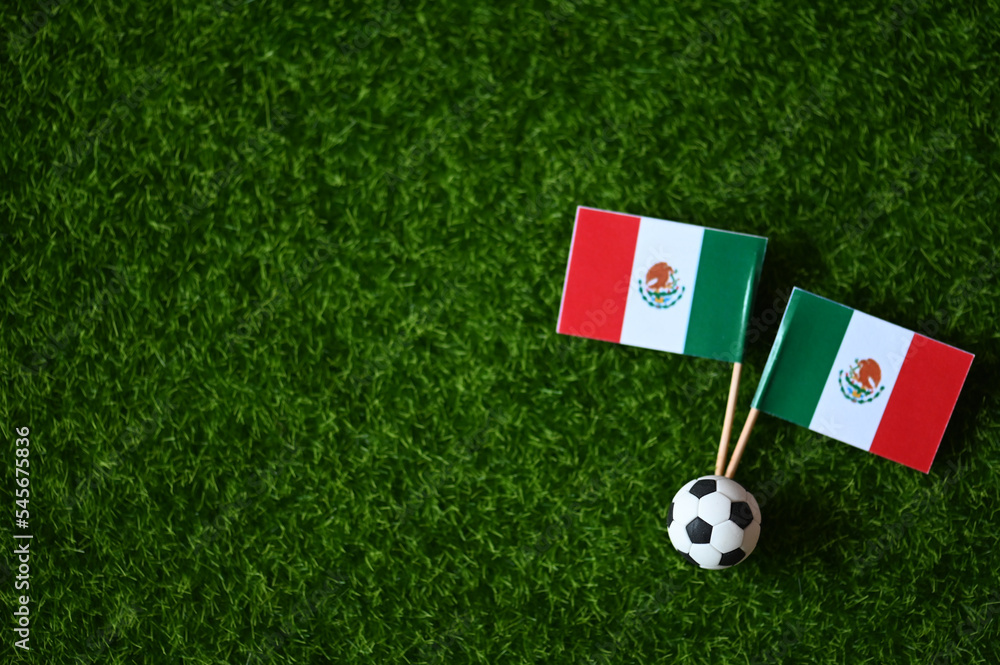Obraz premium 2022 World Cup and Mexico flag on the lawn 2022 World Cup Champion Concept