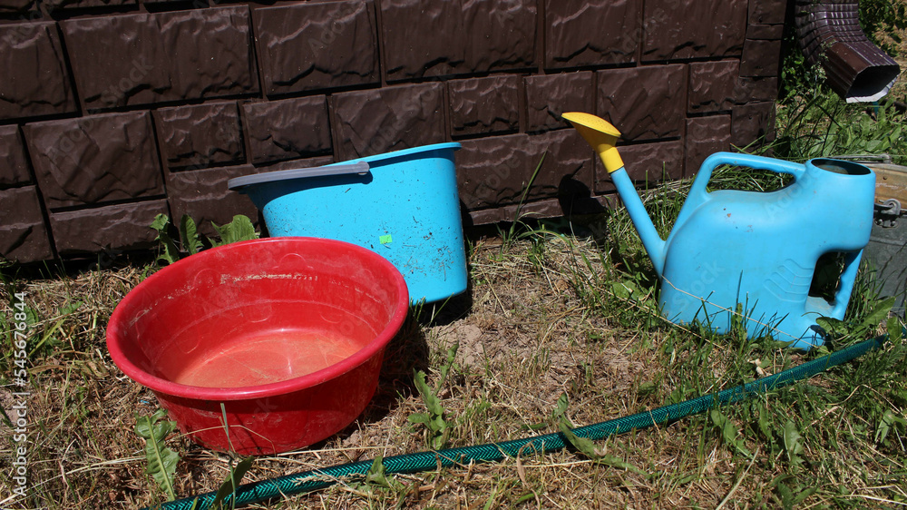 Gardening equipment. Watering can, bucket and basin Gardening equipment. Watering can, bucket and basin