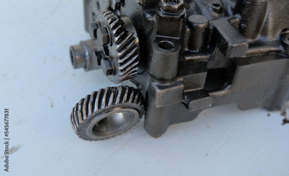 Broken gear on the balancer shafts and oil pump drive in a car engine Broken gear on the balancer shafts and oil pump drive in a car engine