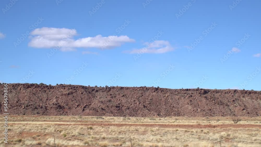 Road trip to Grand Canyon, Arizona USA, driving auto from Utah. Hitchhiking traveling in America, local journey, wild west calm atmosphere of indian lands. Colorado plateau from car window.