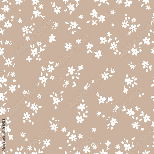 Cute floral pattern. Seamless vector texture. An elegant template for fashionable prints. Print with small white flowers and  leaves. beige  background.