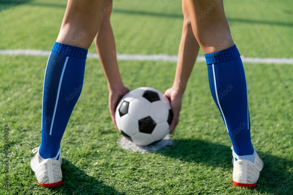 football player set ball football on grass at freekick point before shoot or kick to win a score in international league football match