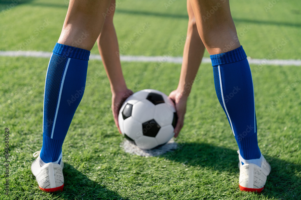 football player set ball football on grass at freekick point before shoot or kick to win a score in international league football match football player set ball football on grass at freekick point before shoot or kick to win a score in international league football match