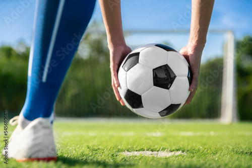 football player set ball football on grass at freekick point before shoot or kick to win a score in international league football match © kunchainub