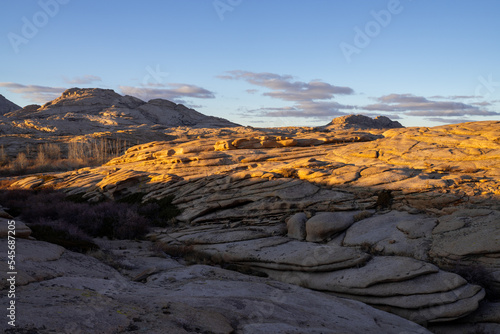 Numerous rocks created by volcanic formations look similar to large cake layers. Bektau-Ata mountain range, Kazakhstan. © Kira0Kirina