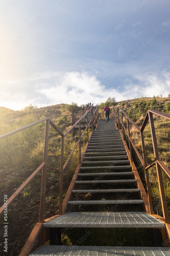 Steep stairs to the Studlagil observatory viewpoint in Iceland, known for its columnar basalt rock formations and the blue-green water that runs through it.