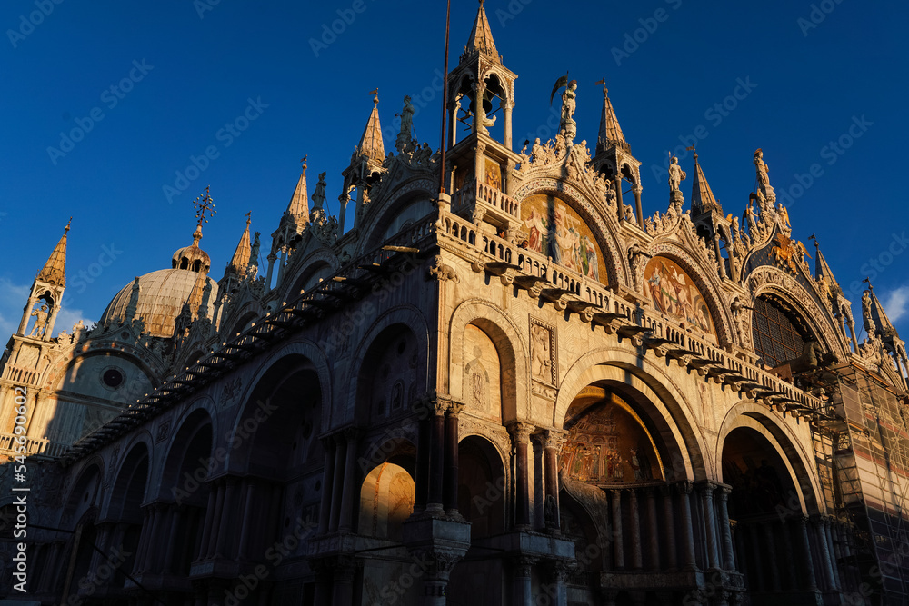 Architectural detail of the basilica of Saint Mark in Venice, Italy at sunset