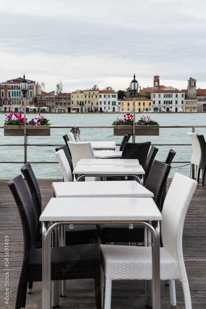 Beautiful restaurant by the canal water in Venice, Italy
