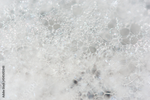 soap bubbles washing powder flowing close up