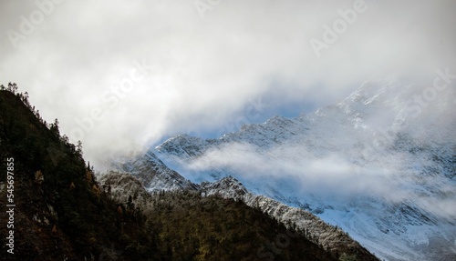 Peaks of mountains covered with clouds