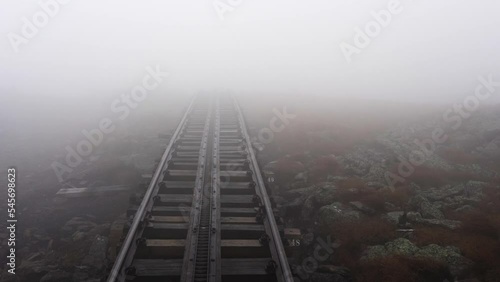 Journey through fog up Mount Washington on the world's first biodiesel cogwheel railroad in the White Mountains of northern New Hampshire, USA.