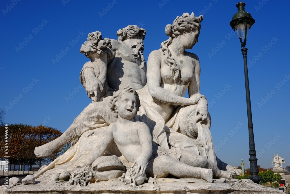 Beautiful shot of the La Seine et la Marne statue in Tuileries Gardens, Paris