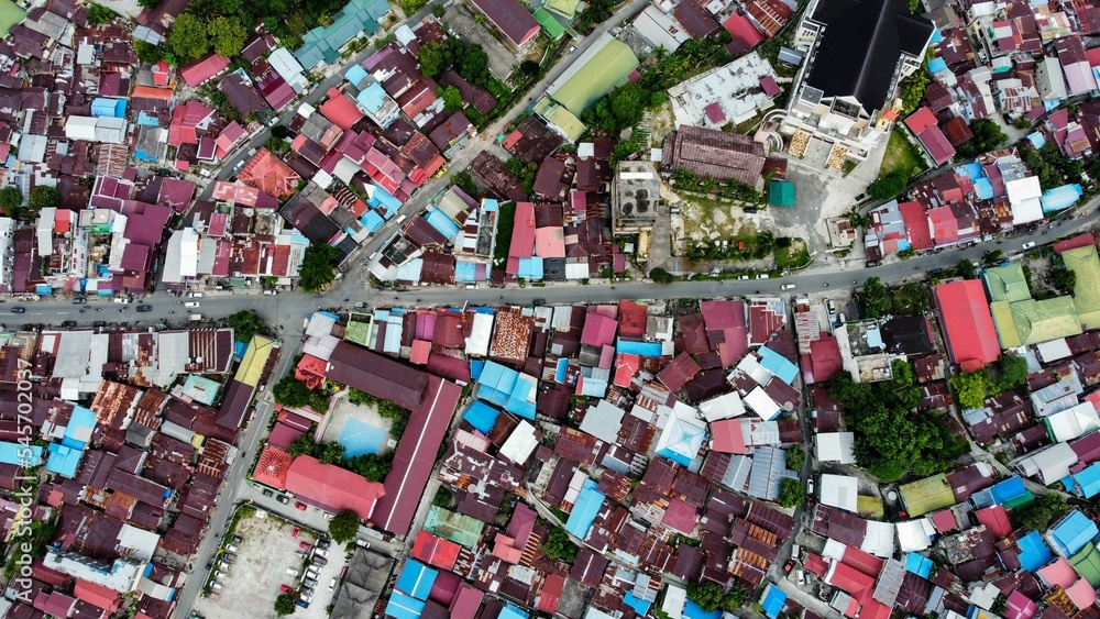 Aerial shot of residential buildings and asphalt roads in Balikpapan, Indonesia