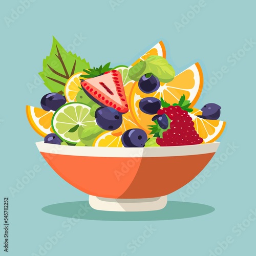 Bowl of fruit salad on blue background