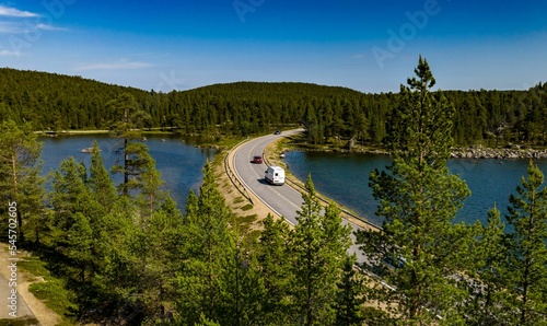 Motorhome and cars driving in Inari, Lapland