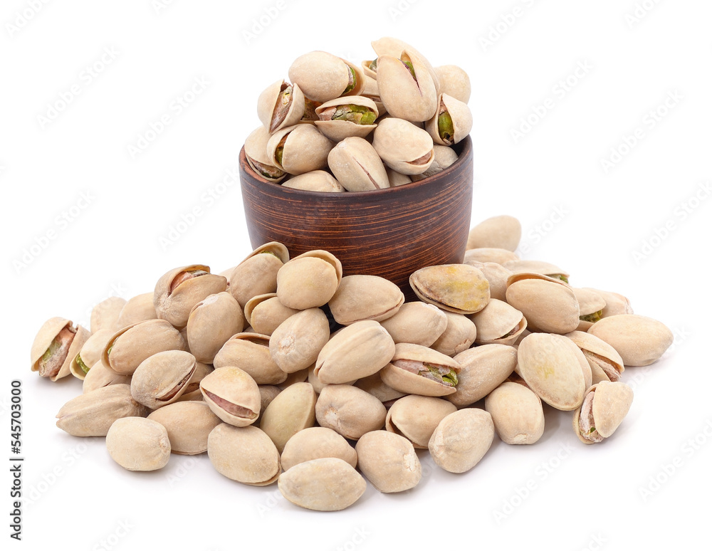 Bunch of pistachios in shell and cup. Bunch of pistachios in shell and cup.